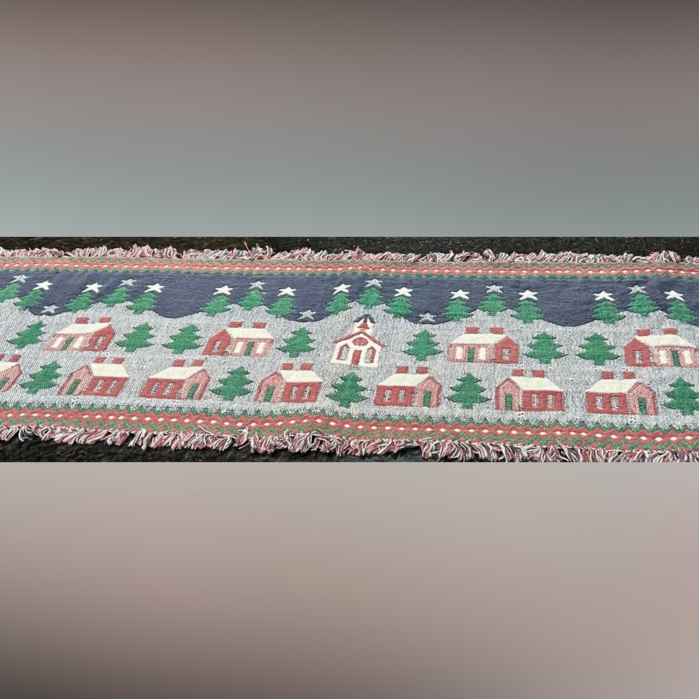 Table runner with churches, trees and houses.